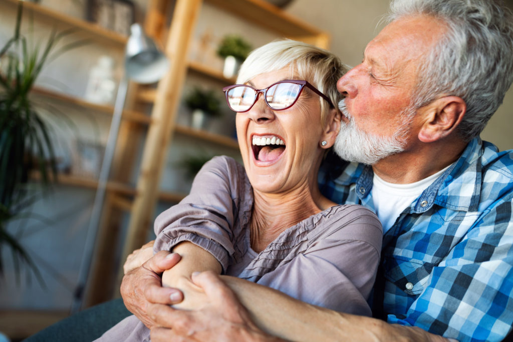 Cheerful happy senior couple enjoying life and spending time together after signing up with their Local Medicare Agent.
