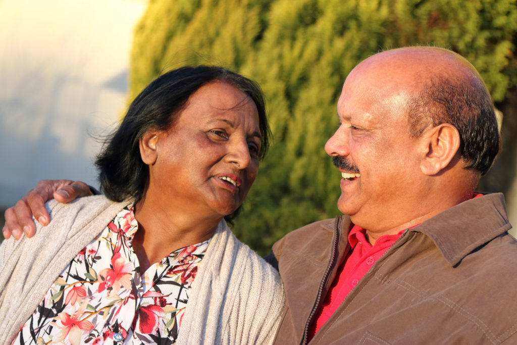 Older Indian couple with the wife asking the husband "When can I enroll into a Medicare Supplement (Medigap) plan?"